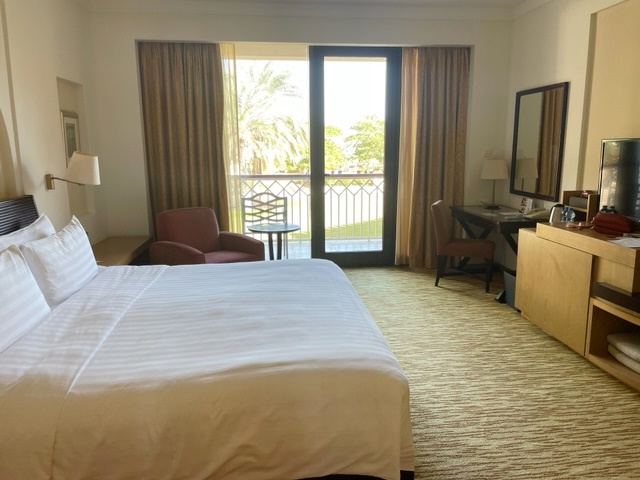 hotel bedroom with a garden view