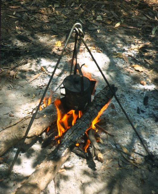 A billy can for tea over a fire in Kakadu National Park, Australia