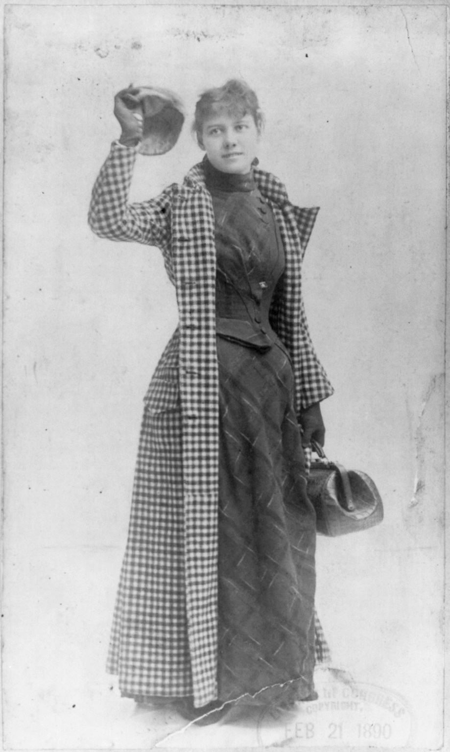 Nellie Bly in her legendary travel attire with her dress visible