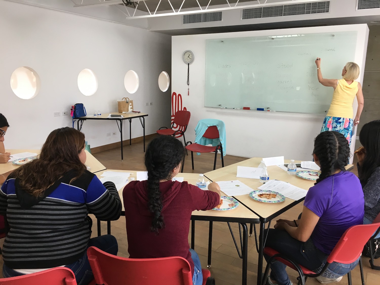 lady teaching by a white board