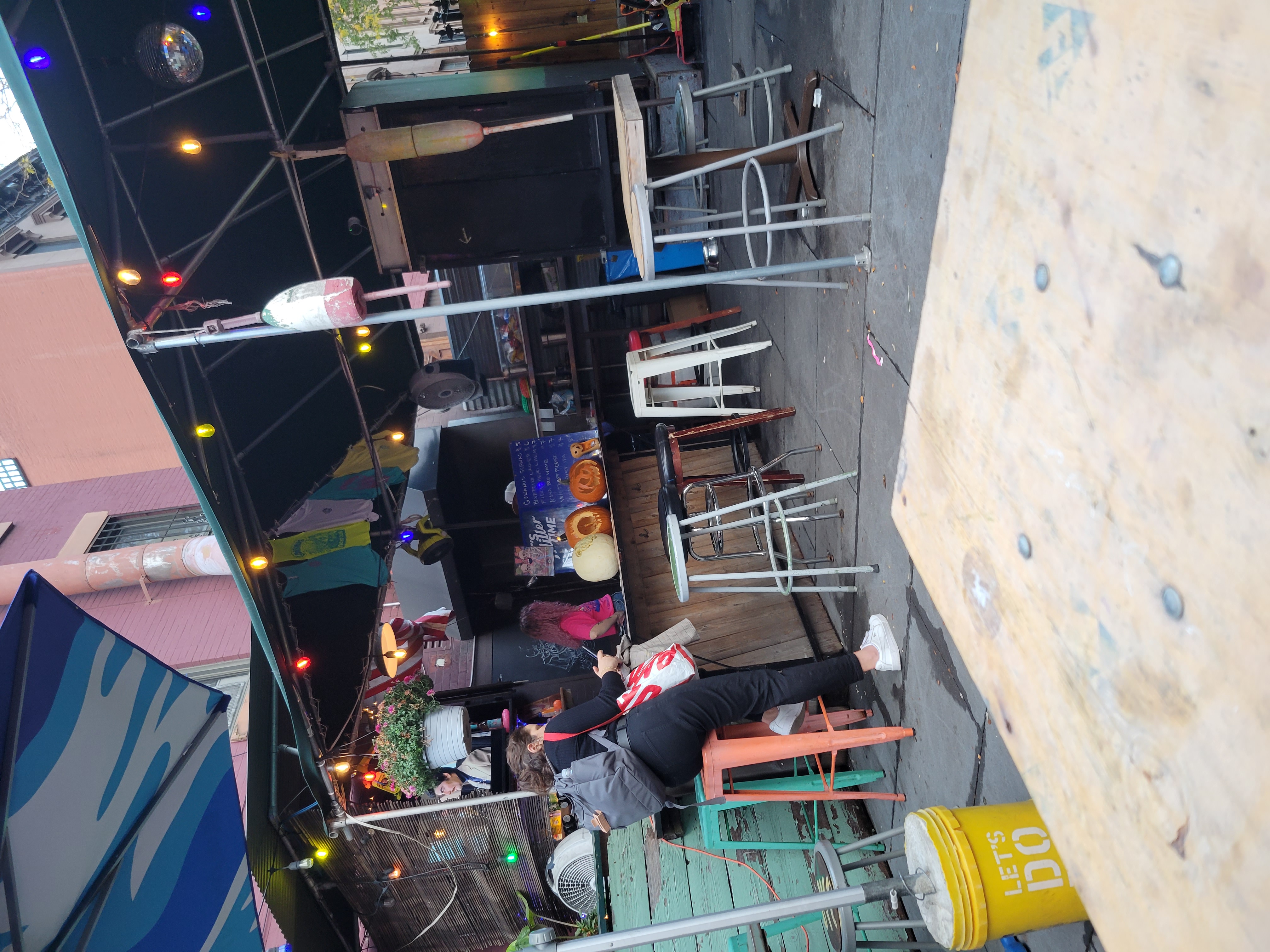 girl sitting on bar stool at Brooklyn Gowanus Yacht Club