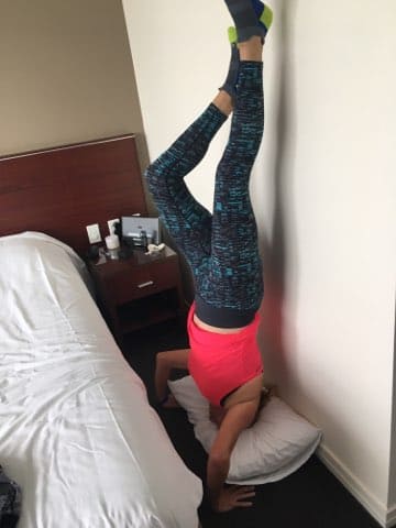 lady doing a headstand