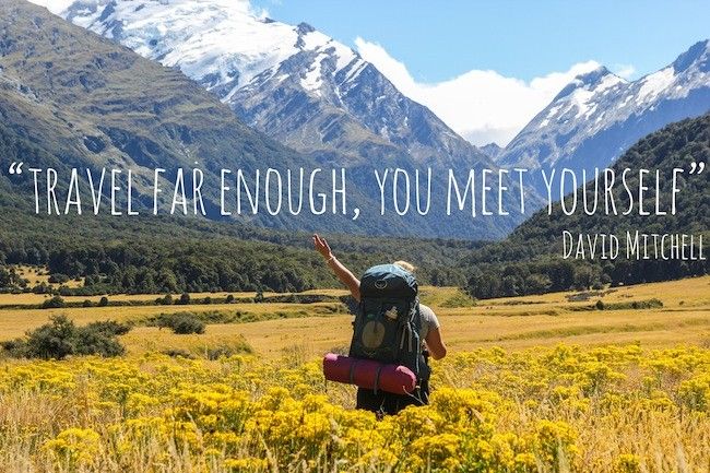 travel far enough you meet yourself quote - hiker in golden fields and snow topped mountains