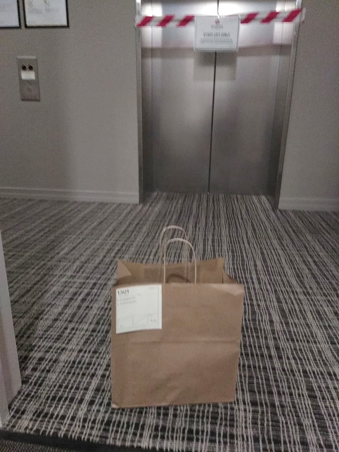 paper bag by a lift