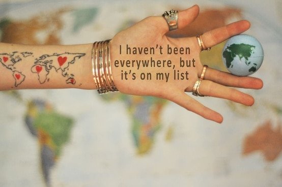 everywhere is on my list quote - hand with writing on and holding a globe