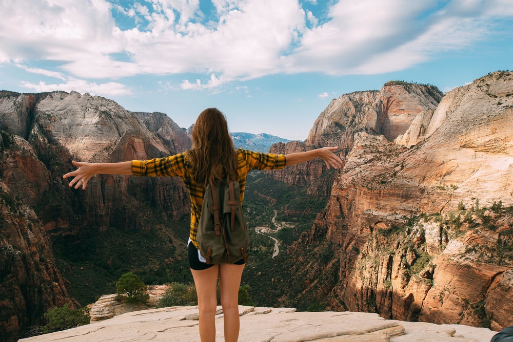 girl hiking with mountain views