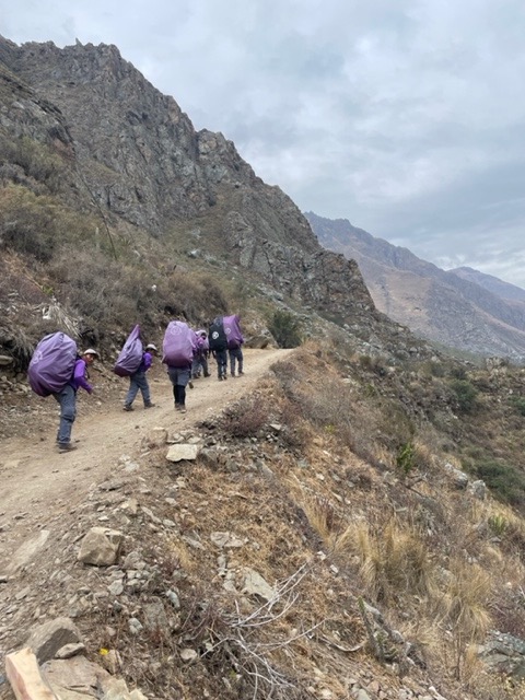 Porters on the Inca Trail carrying huge bags