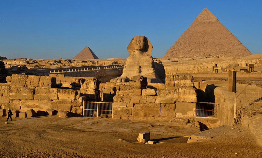The Sphinx with the Pyramids behind